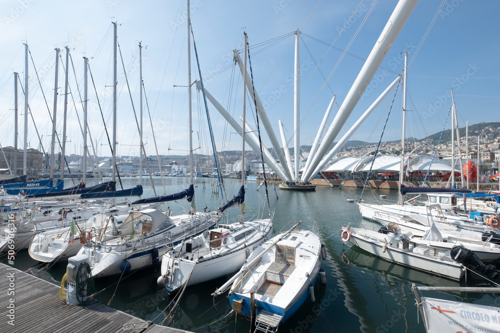 Old Port Porto Antico of Genoa with yachts and boats under stormy sky. Genoa, Italy Old Port Porto Antico of Genoa with yachts and boats under stormy sky. Genoa, Italy