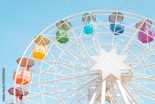 Ferris wheel against blue sky photo