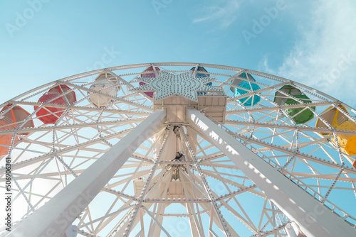 Ferris wheel against blue sky