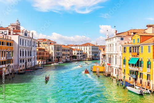 Channel of Venice with luxurious houses  gondolas and boats  Italy