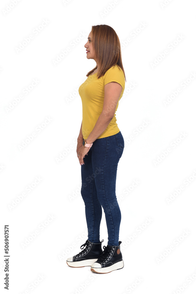 side view of woman with slim jeans on white background side view of woman with slim jeans on white background