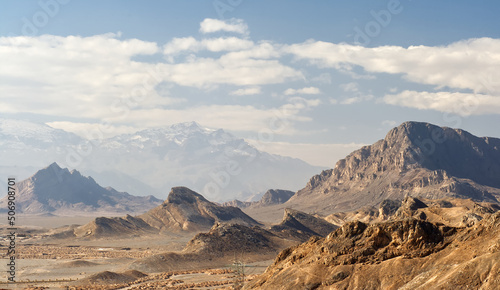 Wrinkled desert landscape around the Zoroastrian burial site Towers of Silence in Yazd, central Iran, Persia. photo