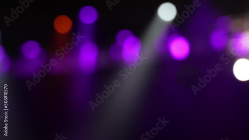 Flashing strobing purple light from spotlights in theatre during performance. Abstract motion backgrounds for music videos photo