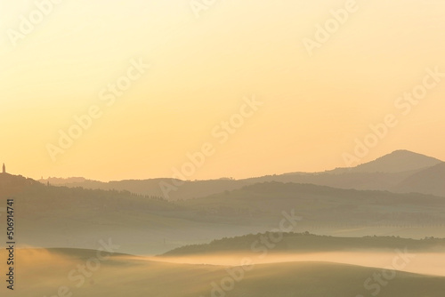 Sunrise with fog over a valley in Tuscany - Italy IX