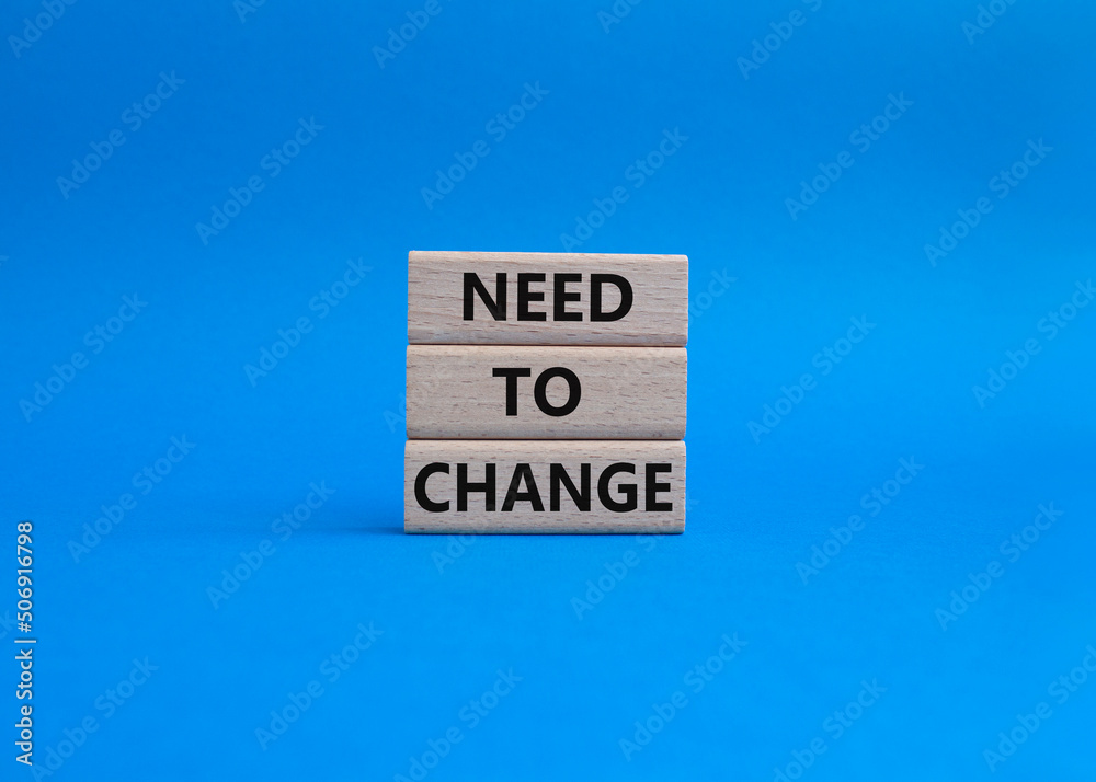 Need to change symbol. Concept words 'Need to change' on wooden blocks. Beautiful blue background. Business and Need to change concept. Copy space. Need to change symbol. Concept words 'Need to change' on wooden blocks. Beautiful blue background. Business and Need to change concept. Copy space.