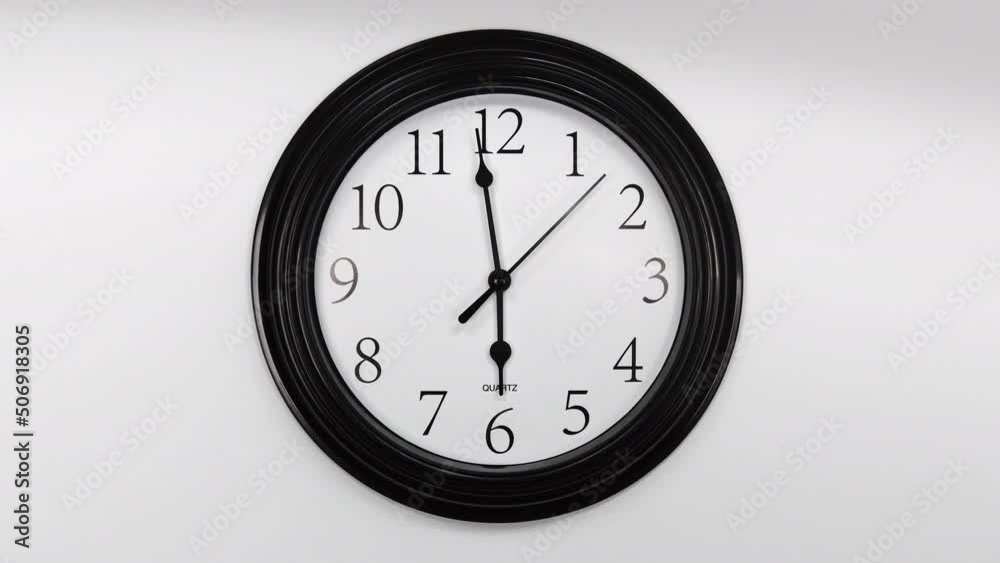 Classic Black Wall Clock With White Background. Black Hands On The Clock. Timelapse. Wall Clock Face Beginning Of Time Of 6.00 Am Or Pm. 4k. ProRes. Classic Black Wall Clock With White Background. Black Hands On The Clock. Timelapse. Wall Clock Face Beginning Of Time Of 6.00 Am Or Pm. 4k. ProRes.