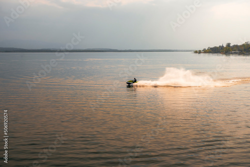 A water scooter floating on the lake in Nysa at sunset