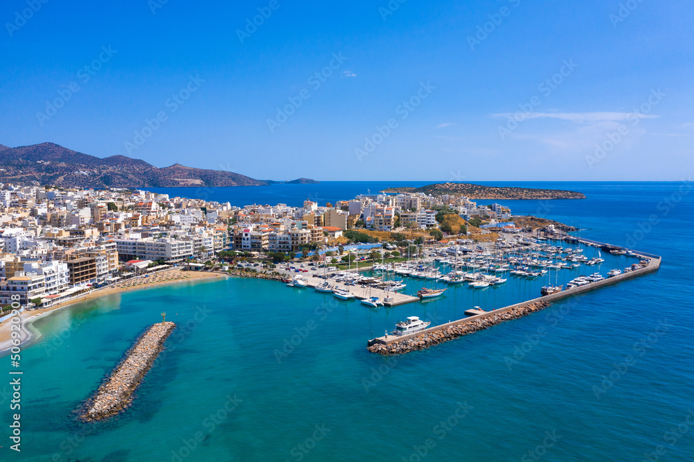Agios Nikolaos,  a picturesque coastal town with colorful buildings around the port in the eastern part of the island Crete, Greece