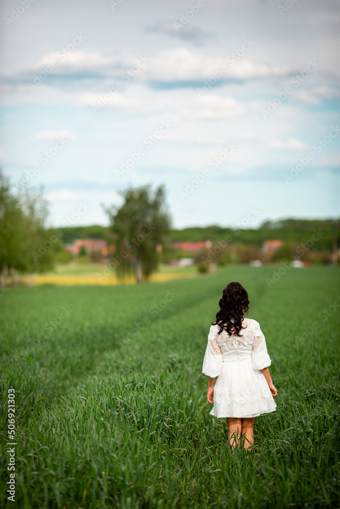 Vinnytsia, Ukraine. May 5, 2022. A girl in a white dress in nature walks and rests Vinnytsia, Ukraine. May 5, 2022. A girl in a white dress in nature walks and rests