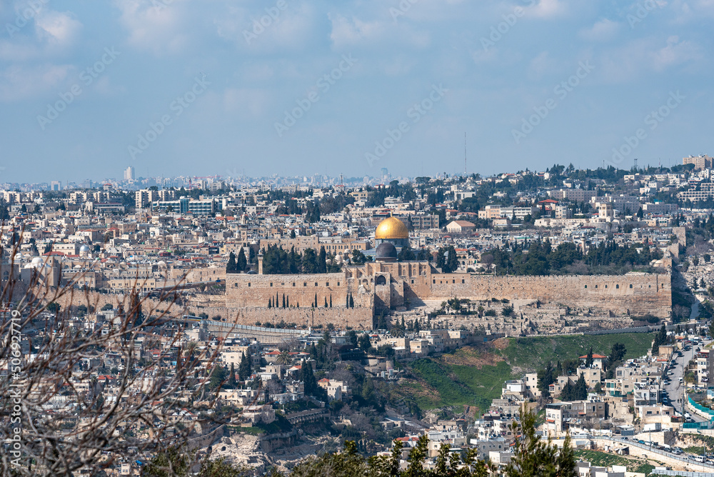 Jerusalem old city, holy mountain. Jerusalem of Gold under cloudy sky - old town view from Mount of Olives