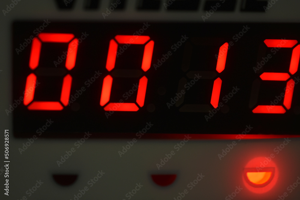 The number 13 on the electronic clock display The number 13 on the electronic clock display