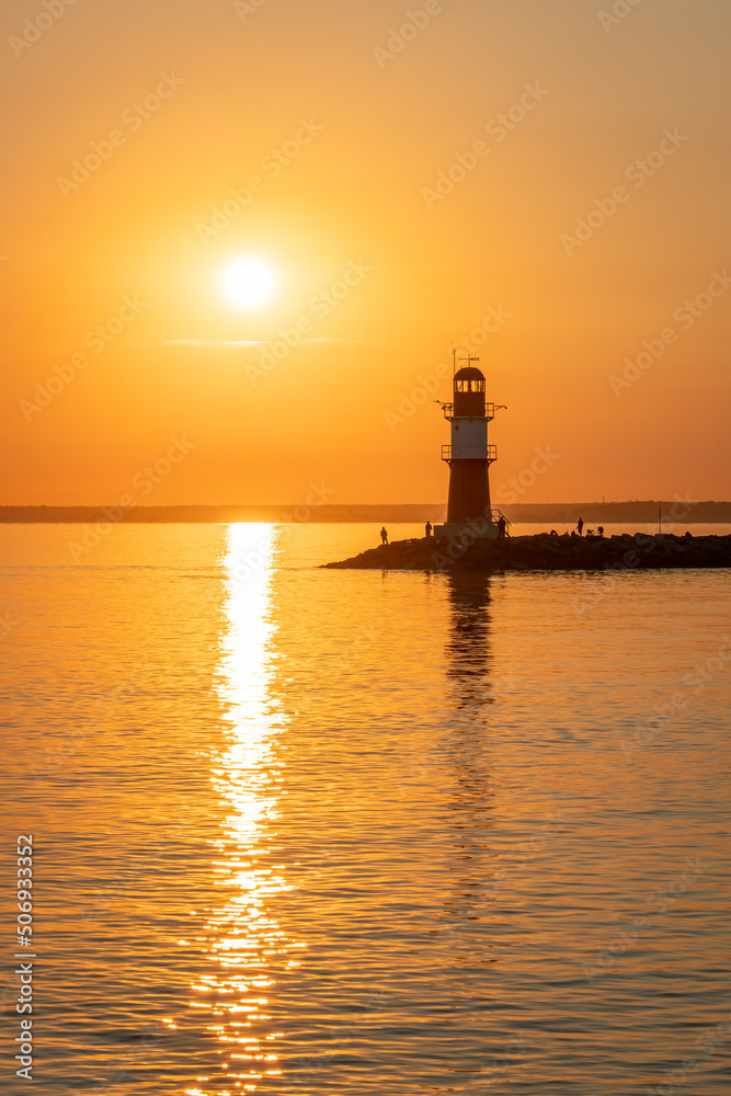 Lighthouse Ostmole Warnemünde at sunrise, Warnemünde, Rostock, Mecklenburg-Vorpommern, Germany Lighthouse Ostmole Warnemünde at sunrise, Warnemünde, Rostock, Mecklenburg-Vorpommern, Germany