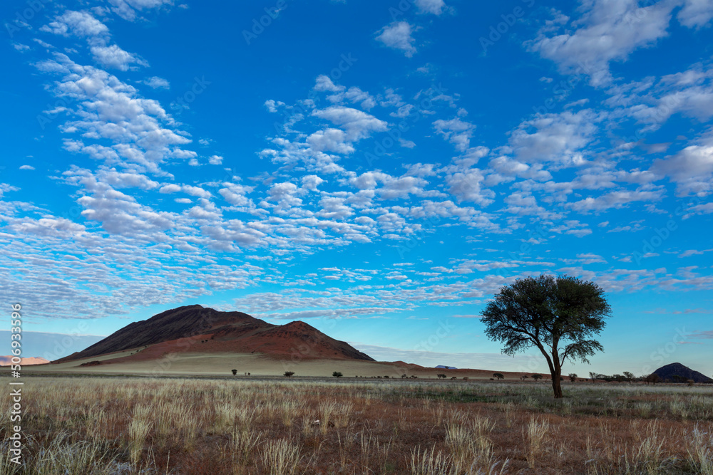 White altocumulus clouds against blue sky White altocumulus clouds against blue sky