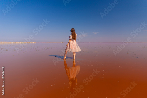 Woman on Pink Lake. Crimea Sasyk Sivash photo