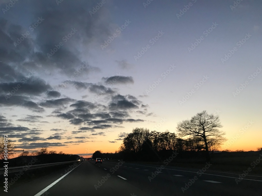 driving on the highway at sunset