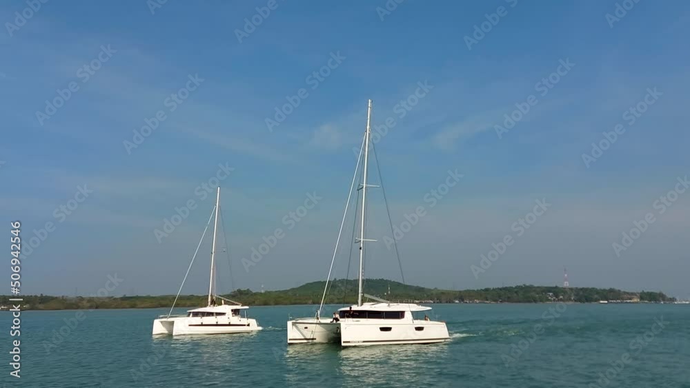 Sailing catamarans move on the sea, sailing yachts move without sails Sailing catamarans move on the sea, sailing yachts move without sails