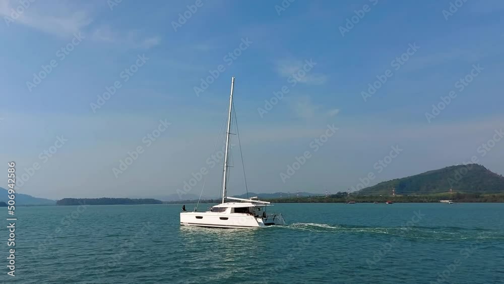 Sailing catamarans move on the sea, sailing yachts move without sails