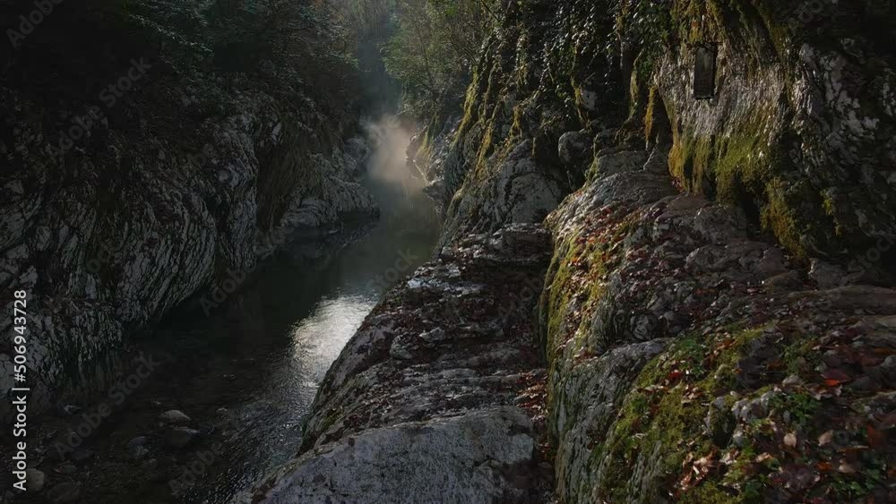 River in a narrow canyon with white rocks. Yew boxwood grove, Devil's Gate Gorge. Drone view. White cliffs and the hosta river in the foggy haze of autumn. Sochi, Krasnodar Territory River in a narrow canyon with white rocks. Yew boxwood grove, Devil's Gate Gorge. Drone view. White cliffs and the hosta river in the foggy haze of autumn. Sochi, Krasnodar Territory
