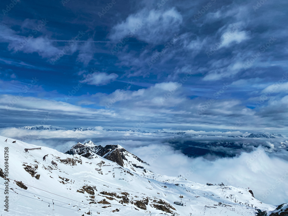 snow covered mountains with dramatic clouds, Kitzsteinhorn glacier, Austria, copy space