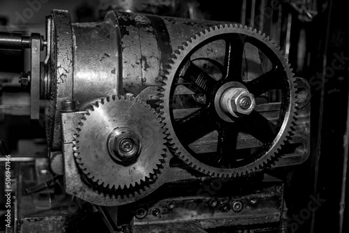  Metalworking workshop, metal processing machines. Vintage Industrial Machinery in a old factory - black and white photo