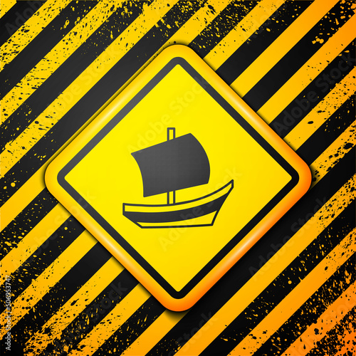 Black Egyptian ship icon isolated on yellow background. Egyptian papyrus boat. Warning sign. Vector