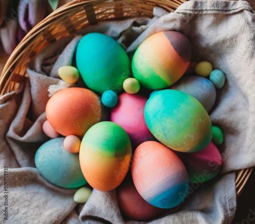 Close up top view of basket of colorful dyed Easter eggs.