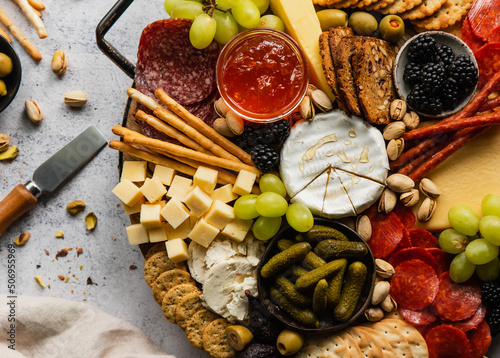 Foto Close up of charcuterie board of cheese, meat, crackers and fruit