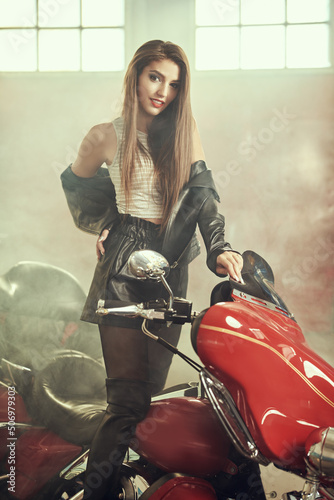 alluring girl on red motorcycle