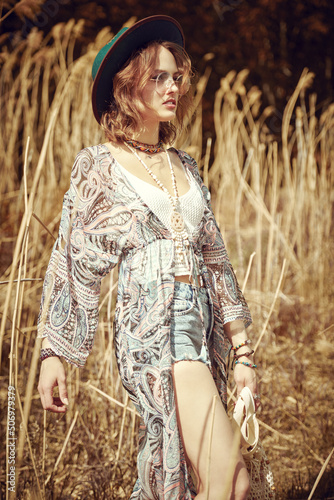 boho girl among reeds