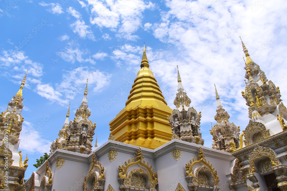 Gold yellow pagoda  on bright blue sky cloud at Sri Don Mun Temple, Chiang Mai, Thailand