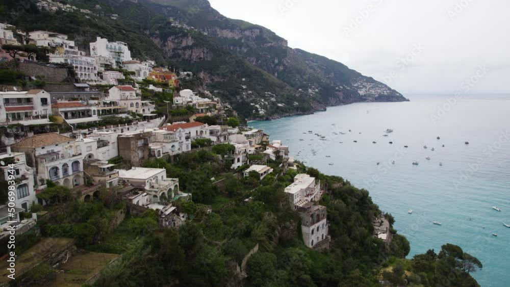 Aerial View Of The Hillside Settlement In Positano And Pristine Waterscape Of Amalfi Coast, Italy . Lateral Shot Aerial View Of The Hillside Settlement In Positano And Pristine Waterscape Of Amalfi Coast, Italy . Lateral Shot