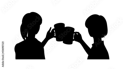 Silhouette of two young women toasting with beer mugs