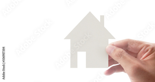 Hands holding paper house, family home