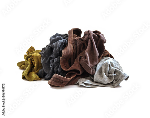 Piles of unwashed clothes on a white background.