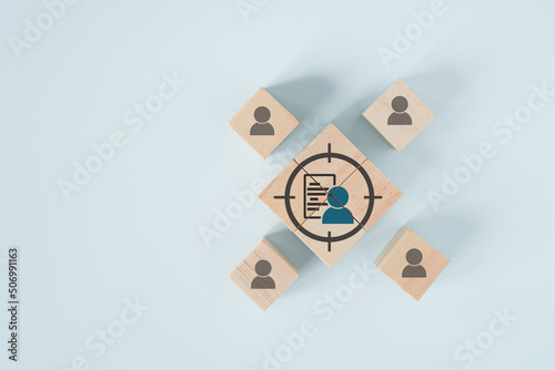 person and data sheet in focus icon on wooden cube block  for buyer persona and target customer concept, buyer or customer psychology profile or characteristics