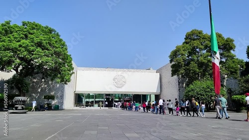 timelapse of a long line of passers-by waiting to enter the national museum of anthropology in mexico city photo