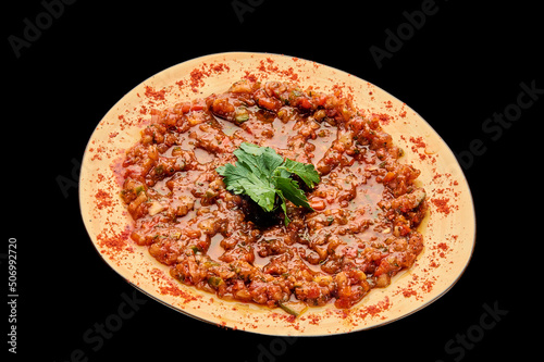 Ezme Turkish appetizer-salad on a black isolated background photo