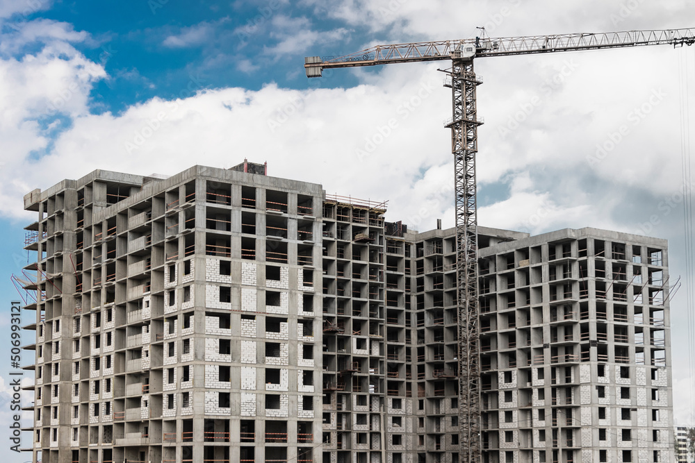 Monolithic frame construction of the building. Solid walls of concrete. The framework for the walls. Formwork for walls made of concrete. Construction site close up.