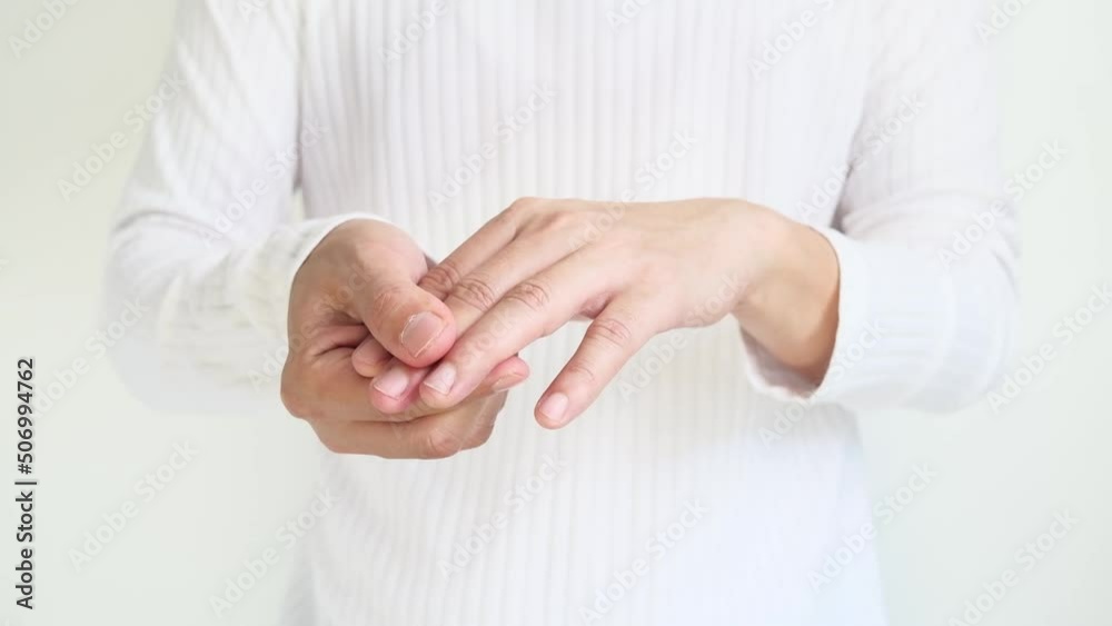 man touching wrist and thumb He squeezed his thumb and wrist. He had a