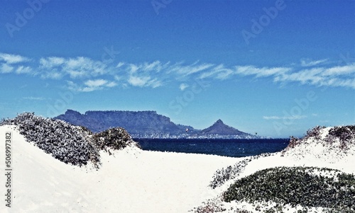 Landscape with kite surfer having fun on the Atlantic ocean and Table Mountain in the background mixed media photo