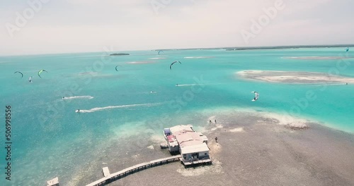 Group people flysurfing on caribbean sea, aerial shot over Palafitte spot, Los Roques photo