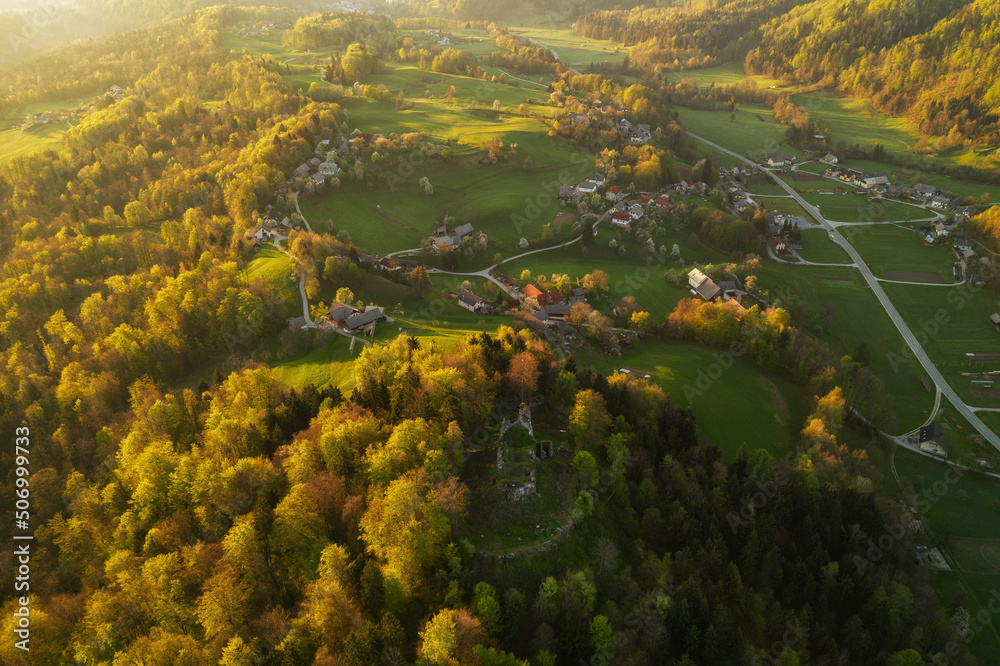 Aerial view of the fog in the valley of the countryside. Beautiful spring sunrise in Slovenia. 