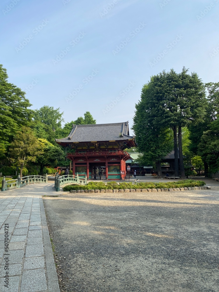 Ancient bridge that leads to the pagoda of Japanese shrine “Nezu”, downtown Tokyo year 2022 May 20th