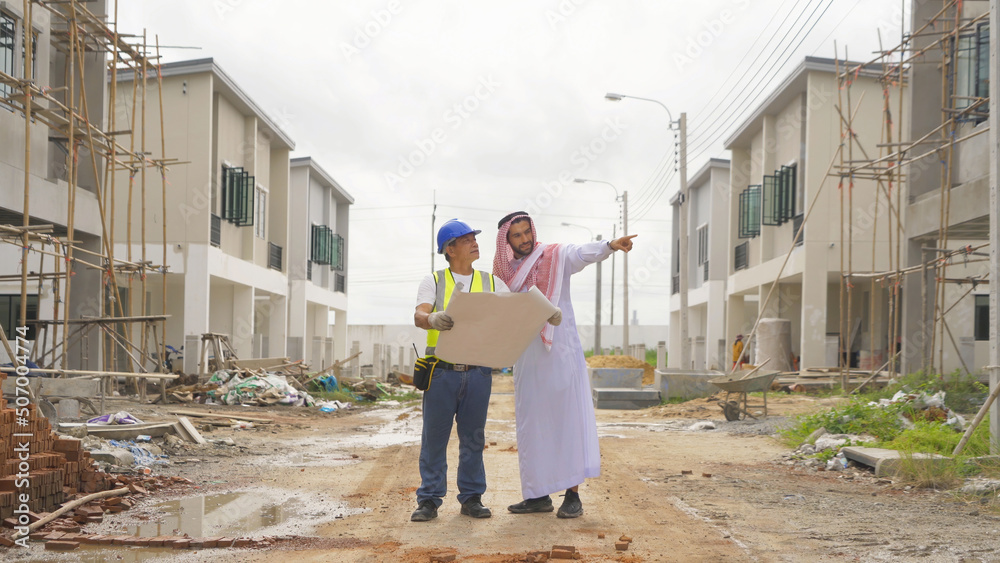 An arabian or muslim man, a designer architect working on industrial construction site at home architecture building project. People lifestyle.