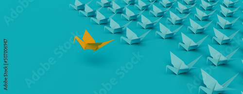 Business Concept with Origami Birds on a Turquoise background. 