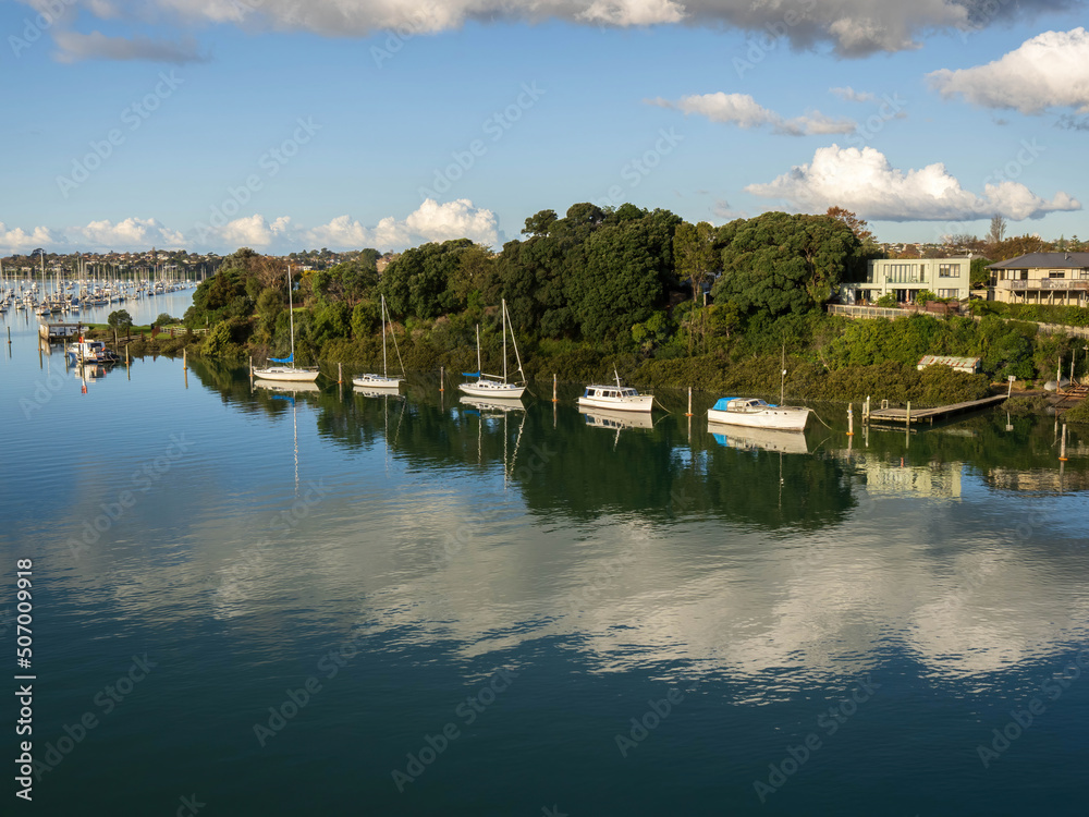 Fototapeta premium Aerial view of Tamaki river (Auckland, New Zealand) with moored boats
