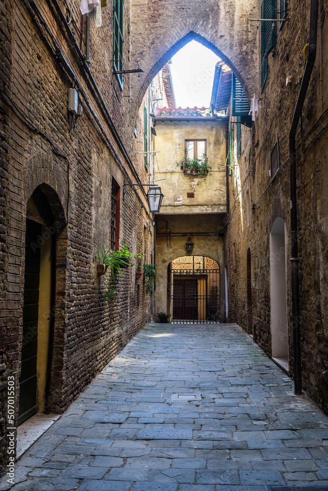 colorful street view of siena city, italy