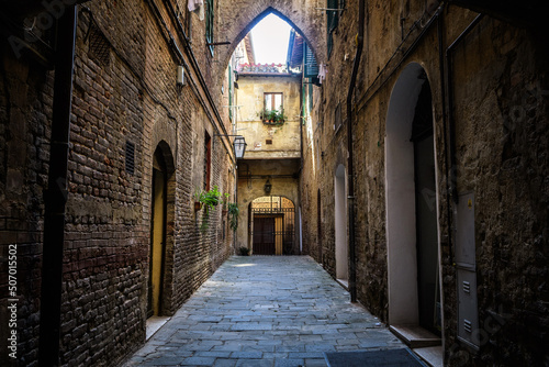 colorful street view of siena city, italy © jon_chica