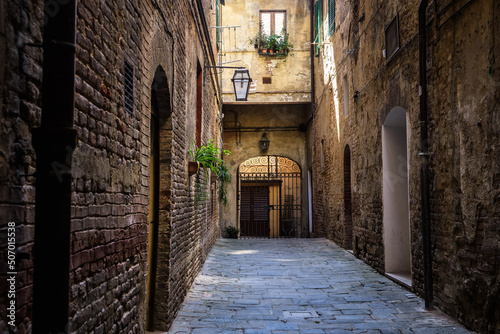 colorful street view of siena city, italy © jon_chica