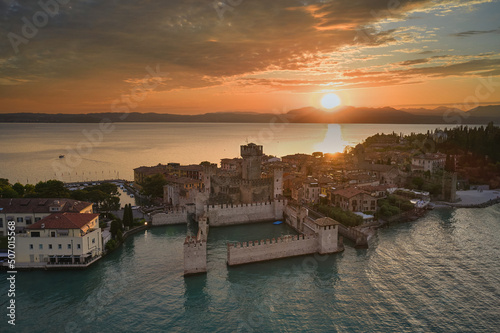 Sirmione sunset aerial view. Sunset over lake garda in Italy, drone view.
